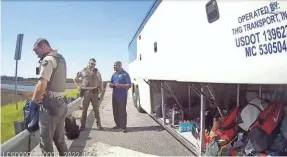  ?? LENSLOCK.COM ?? Body camera footage showing Liberty County deputies beginning their search of luggage belonging to the Delaware State University women’s lacrosse team during a traffic stop late last month. The team’s bus driver talks to one of the officers.