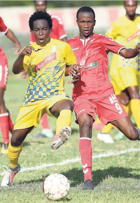  ??  ?? Harbour View’s Johann Weatherly (left) battles UWI FC’s Rochane Smith for possession of the ball during their Red Stripe Premier League clash at the UWI Mona Bowl, which ended in a 2-2 draw.