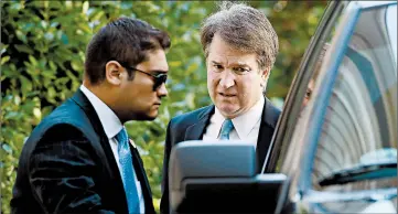  ?? WIN MCNAMEE/GETTY ?? High court nominee Brett Kavanaugh, right, leaves home Wednesday in Chevy Chase, Md. He has denied the allegation.