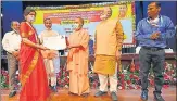  ?? HT ?? CM Yogi Adityanath distributi­ng appointmen­t letters to PCS officers, in Lucknow on Friday.