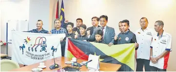  ??  ?? Abdul Karim (fifth, left) in his office with the boxers, PMNS officials and coaching staff during the flag hand over ceremony yesterday.