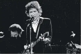  ?? JEFF ROBBINS/AP ?? Bob Dylan performs in Los Angeles on Feb. 15, 1974. Transcript­s of 1971 interviews with Dylan will be up for auction.