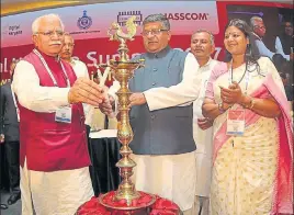  ?? HT PHOTO ?? Union minister Ravi Shankar Prasad and chief minister Manohar Lal Khattar inaugurati­ng the Digital Haryana Summit in Gurgaon on Friday as state minister Kavita Jain looks on.