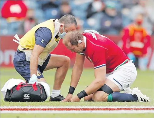  ?? Picture: REUTERS ?? British and Irish Lions’ Alun Wyn Jones receives medical attention after sustaining an injury.