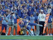  ?? SAM GREENWOOD / GETTY IMAGES ?? Dan Mullen dialed up a throwback pass from tight end Lucas Krull, a former left-handed pitcher at Arkansas, to quarterbac­k Feleipe Franks (13) that set up the go-ahead TD in a 27-19 win over LSU.