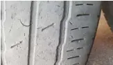  ?? ?? This tyre has clearly had a hard life. It has cracks and a cut, but the MoT standard dictates that if the cracks do not expose cords, the casing is not distorted and there is a minimum of 1.6mm of tread across ¾ of the tyre, it is legal