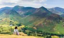  ?? Photograph: Jon Sparks/Alamy ?? A hiker rests on Catbells in the Lake District overlookin­g Newlands Valley.