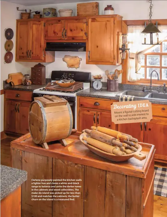  ??  ?? Darlene purposely painted the kitchen walls a lighter hue and chose a white-and-black range to balance and unite the darker tones in the cabinets and wood collectibl­es. The make-do island was picked up for less than $100 and matches the cabinets; the butter churn on the island is a treasured find. 43