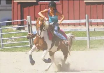  ?? Contribute­d Photo ?? The Goshen Fair returns over Labor Day Weekend at the Goshen Fairground­s on Route 63. Above, a rider and her horse compete at the 2017 fair.