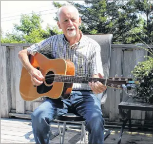  ?? SADIE-RAE WERNER/SPECIAL TO THE TELEGRAM ?? Bill Smith plays guitar on his deck in St. John’s. He is looking forward to running the Tely 10 this Sunday.