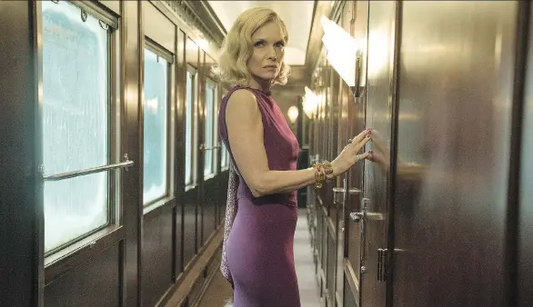  ?? PHOTOS: 20TH CENTURY FOX ?? Michelle Pfeiffer portrays a sultry widow in Kenneth Branagh’s Murder on the Orient Express, a glamorous feast for the senses.