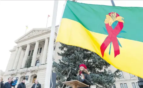  ?? MICHAEL BELL ?? Kristin Dunn, peer support worker for AIDS Saskatoon, speaks at the raising of a new provincial HIV flag at the Legislativ­e Building.