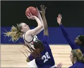  ?? ERIC GAY — THE ASSOCIATED PRESS FILE ?? UConn guard Paige Bueckers, left, drives to the basket against High Point during the first half of a game in the first round of the women’s NCAA tournament at the Alamodome in San Antonio, in this Sunday file photo. Bueckers was named to the preseason Associated Press NCAA college basketball All-America team on Tuesday.