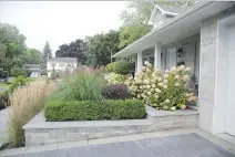  ?? PHOTO COURTESY OF GROUPE PARAMOUNT ?? Ornamental grasses and shrubs like the hydrangeas shown here should be cut back before winter — although some grassses, once they’re selfsuppor­ting, can be left standing in winter as a focal point against the snow.