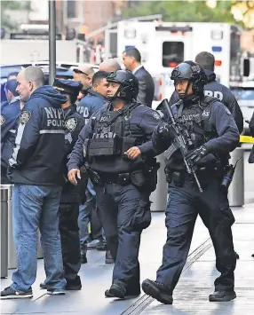  ?? USA TODAY ?? Police work the scene at Columbus Circle in New York, where a suspicious package was found at CNN.