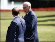  ?? EVAN VUCCI — THE ASSOCIATED PRESS ?? White House Chief of Staff John Kelly, right, follows President Donald Trump to board Marine One on the South Lawn of the White House, Thursday in Washington.