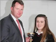  ??  ?? Cllr Malcolm Byrne presents the Fifth Year Spirit of Creagh College Cup to Emma Polglase