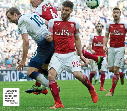  ?? SPORTPIX ?? Flashpoint: Mustafi barges into Kane at Wembley