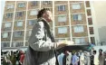  ??  ?? HOMELESS people queue for food at the Carpenter’s Shop in the city centre. |ARMAND HOUGH | African News Agency (ANA)