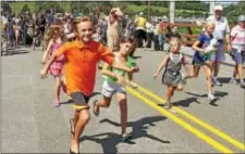  ?? CHRIS BARBER — DIGITAL FIRST MEDIA ?? Children run across the newly opened Route 926 bridge Friday, following the ribbon-cutting ceremony.