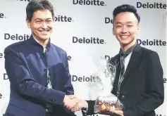  ??  ?? Voon (right) receives The Best Presenter Award from Deloitte’s Southeast Asia Indirect Tax leader Robert Tsang.