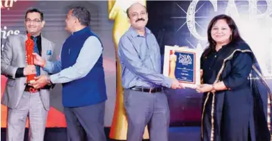  ?? ?? Manish Sharma, Director, Freight Logistics and Surbhi Sharma receiving an award at the recent India Cargo Awards