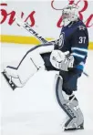  ?? THE CANADIAN PRESS FILE PHOTO ?? Winnipeg Jets goaltender Connor Hellebuyck was 31-21-5 with a 2.57 goals-against average this season.