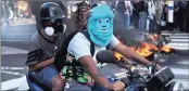  ?? PICTURE: ASSOCIATED PRESS ?? An anti-government protester wearing a mask depicting the Monster Inc character Sulley near a barricade set up by protesters, in Caracas, yesterday.