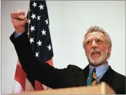  ?? AP FILE PHOTO BY BEN MARGOT ?? In this 1997 photo Democratic Rep. Ron Dellums raises his fist while announcing his retirement from Congress at a news conference in Oakland.