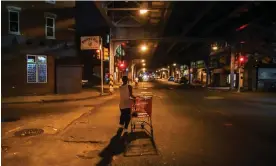  ?? ?? A man pulling a shopping cart walks along Kensington Ave in Philadelph­ia, 2017. ‘There are over 150 channels dedicated to Kensington and all the things that take place here,’ a harm reduction profession­al says. Photograph: The Washington Post/Getty Images