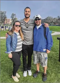  ?? COURTESY OF LORA GRECO VIA AP ?? Lora and Matt Greco flank then-padres player Joey Lucchesi at the 2020 Farmers Insurance Open golf tournament in San Diego. They hosted players in Lake Elsinore — a Class A affiliate for the Padres — for three seasons from 2017-19.