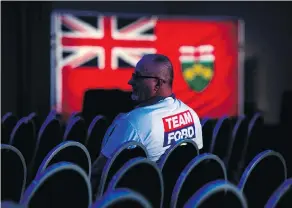  ?? NATHAN DENETTE / THE CANADIAN PRESS ?? A Ontario PC supporter awaits the Ontario results at the Doug Ford election night headquarte­rs in Toronto on Thursday.