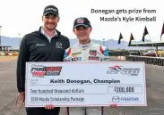  ??  ?? Donegan gets prize from Mazda’s Kyle Kimball