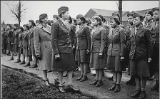  ?? (National Archives) ?? Somewhere in England, Maj. Charity E. Adams of Columbia, S.C., and Capt. Abbie N. Campbell, Tuskegee Institute, Tuskegee, Ala., inspect the first contingent of Black members of the Women’s Army Corps assigned to overseas service. The documentar­y “The Six Triple Eight,” focusing on the work of the 6888th Central Postal Directory Battalion during World War II, screens Tuesday at the MacArthur Museum of Arkansas Military History.