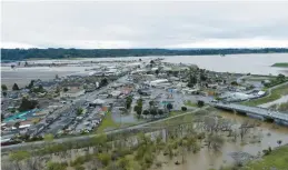  ?? CALIFORNIA STRAWBERRY COMMISSION ?? The Pajaro River floods adjacent areas Tuesday in Pajaro, Calif. Strawberri­es and other crops have been hit hard by the deluge in the Pajaro Valley.