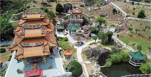  ??  ?? Worth a thousand words: an aerial view of the taoist temple Fu Lin Kong, which boasts a mini Great Wall garden. the island has an interestin­g mix of religious architectu­re to explore.