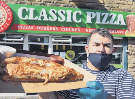  ??  ?? Classic Pizza owner Selim Kilic with “The Best Kebab Calzone”. Despite only being on the shop’s online menu, it is proving to be a hit with customers.