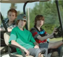  ?? AARON YEGER/THE CANADIAN PRESS ?? Nick Serino, at the wheel, Reece Moffett, in the passenger seat, and Jackson Martin in a scene from Sleeping Giant.