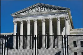  ?? PATRICK SEMANSKY — THE ASSOCIATED PRESS FILE ?? Security fencing surrounds the Supreme Court building on Capitol Hill in Washington.