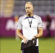  ?? Tim Nwachukwu / Getty Images ?? US coach Gregg Berhalter looks on during a training session at Al Gharafa Stadium on Monday in Doha, Qatar.