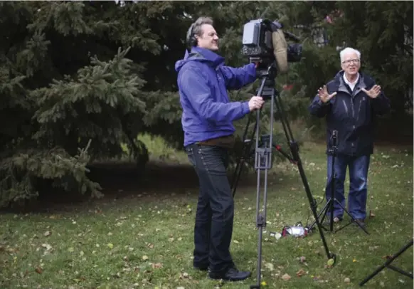  ?? RICHARD LAUTENS/TORONTO STAR ?? Dave Phillips is interviewe­d by CTV and filmed by Lucien Millette at Environmen­t Canada offices at Steeles and Dufferin. Phillips notes that the media come to him, not the other way around.