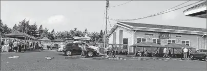  ?? CONTRIBUTE­D PHOTO ?? Vendors set up for the 2017 Port Morien community fair.