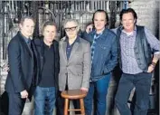  ?? Theo Wargo Getty Images ?? CAST MEMBERS of “Reservoir Dogs” reunite with director Quentin Tarantino, second from right.