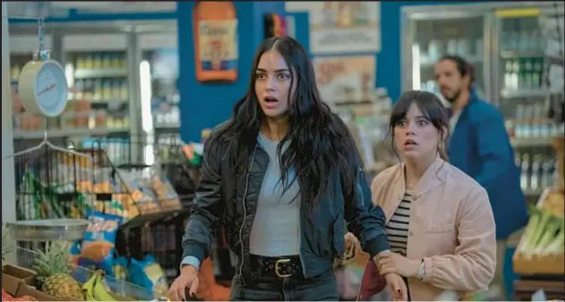  ?? ?? Melissa Barrera (left) with Jenna Ortega in “Scream VI,” opening Friday. Below, the newest masked killer to suit up as Ghostface stalks his victims, this time in the Big Apple.