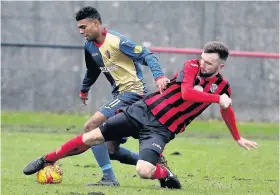  ??  ?? Challenge Kilby’s Joao Victoria is stopped in his tracks by the Dalbeattie defence