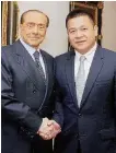  ?? Ansa ?? Berlusconi e Li Yonghong