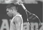  ?? GUSTAVO GARELLO/AP ?? Carlos Alcaraz of Spain reacts after missing a point during an Argentina Open ATP semifinal match against Nicolas Jarry of Chile at the Guillermo Vilas Stadium.