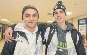  ?? JASON MALLOY/THE GUARDIAN ?? Team P.E.I. hockey manager Tanner Doiron, left, and player Matt McQuaid left for Red Deer, Alta., where the Canada Games begin tonight with the opening ceremonies.