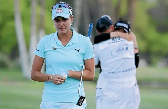  ?? PHOTO: GETTY IMAGES ?? Common sense has gone out the window in golf with a four-stroke penalty costing Lexi Thompson, front, the ANA Inspiratio­n tournament, which was won by So Yeon Ryu.