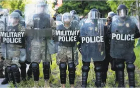  ?? Erin Schaff / New York Times ?? Activeduty military police were among the armed forces that cleared those near the White House peacefully protesting police violence last week.